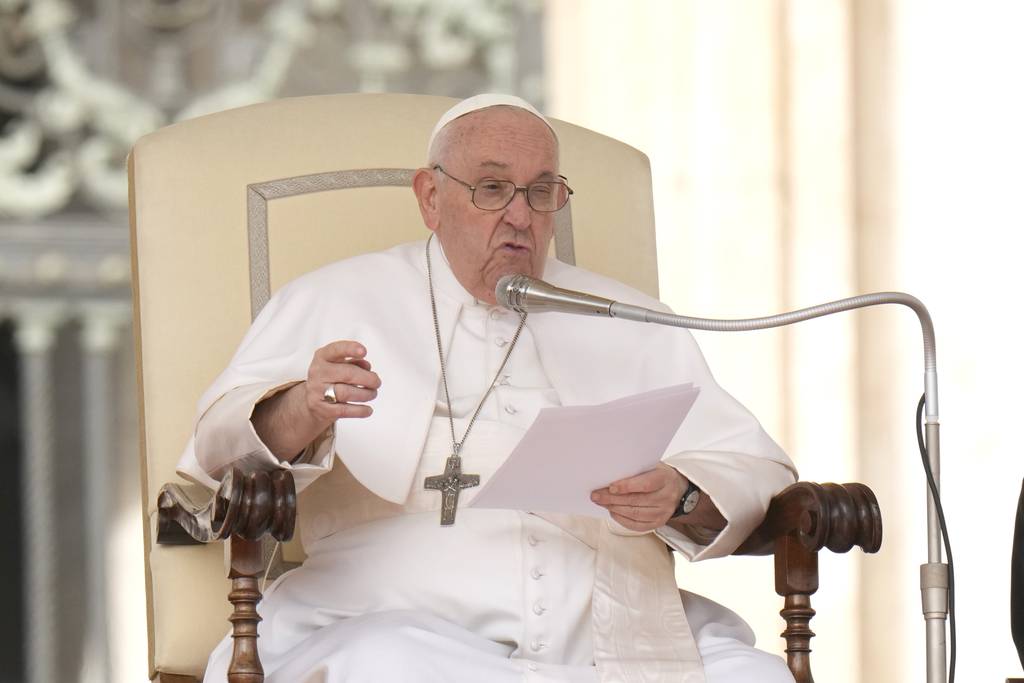 Pope Francis tells transgender youth that "God loves us as we are." In this photo, Pope Francis delivers his speech during his weekly general audience in St. Peter's Square at the Vatican on March 22, 2023. 