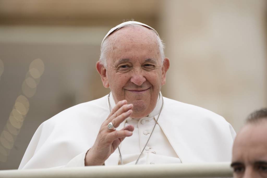 Pope Francis waves at the end of his weekly general audience in St. Peter's Square at the Vatican on May 3, 2023.