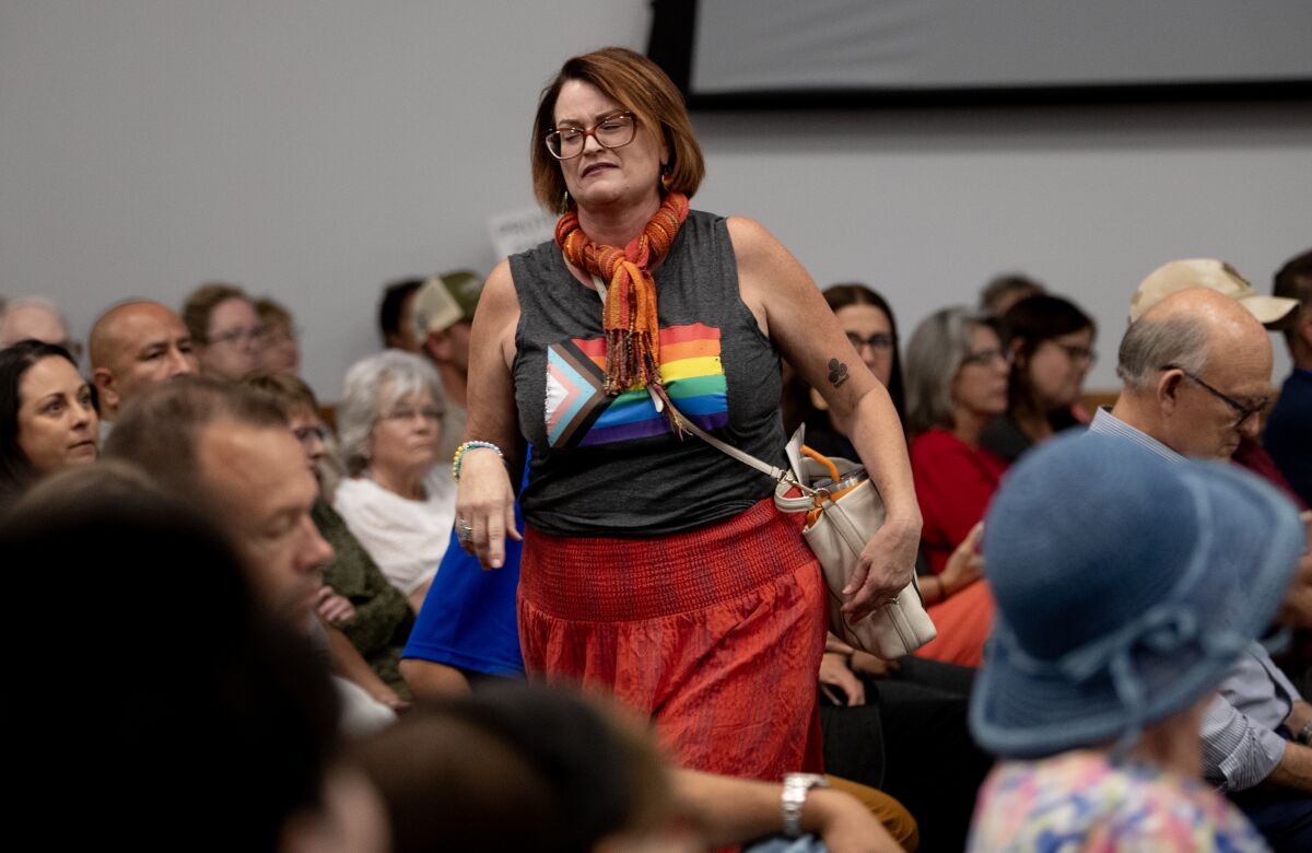 After a marathon meeting, youth pastor and parent Rachel Dennis leaves the Murrieta School Board meeting in frustration.